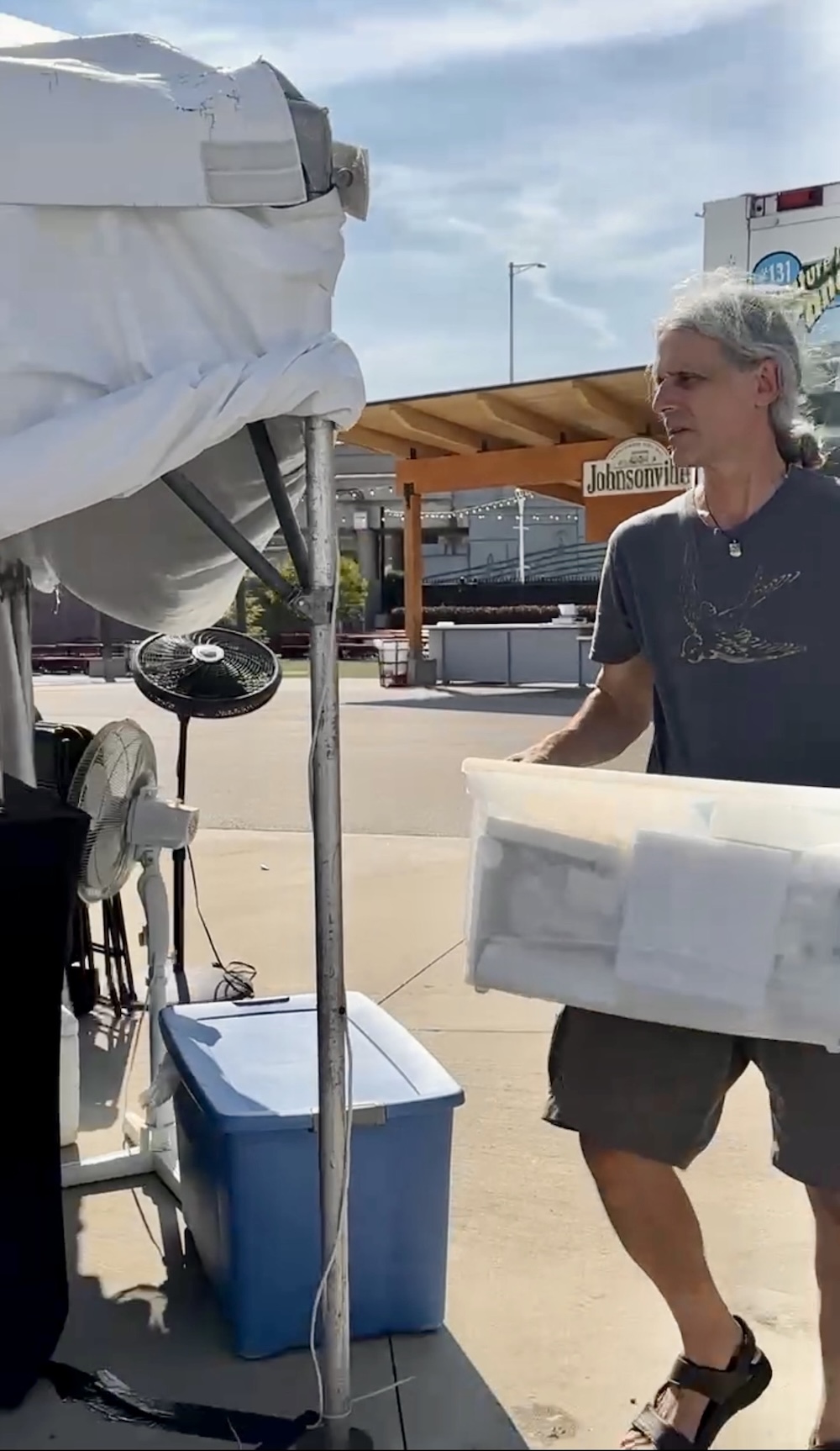 Marc Choyt, former owner of Reflective Jewelry, works on setting up his booth at Milwaukee Irish Fest 2023.